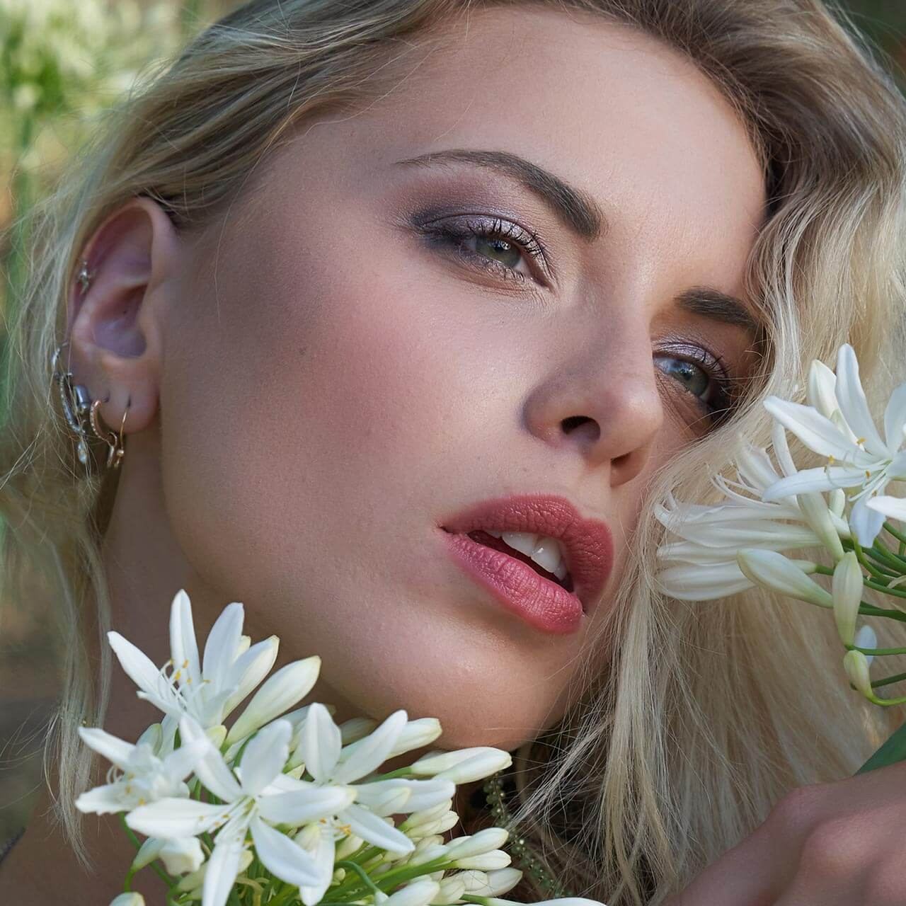After: Portrait of a blonde woman with white flowers
